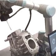 Novacam rotational scanner RS2 on a robotic arm inspects bores in an engine cylinder block